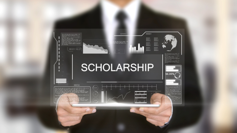 a man with a sign saying "scholarship"